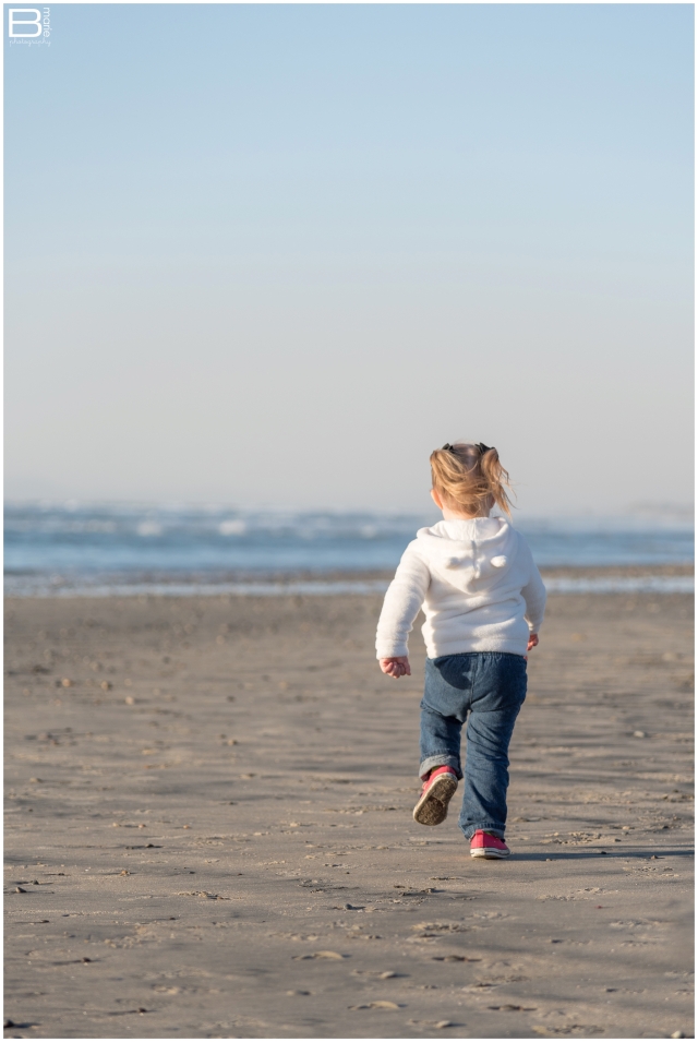 Nacogdoches photographer image of toddler girl running on the beach in San Diego, CA