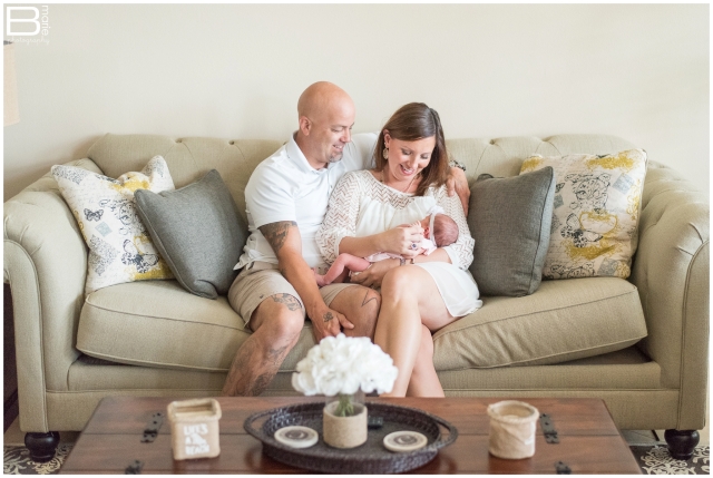 Newborn portraits of baby girl in feminine colors with in-home family portraits